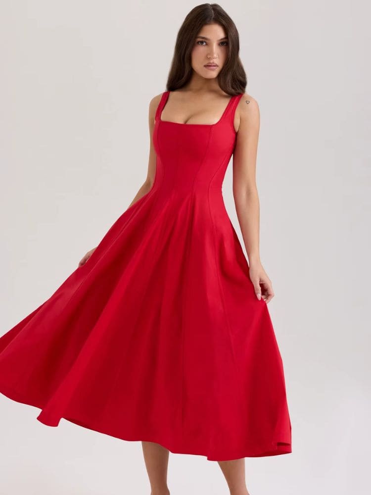 Modelo girando com o vestido midi floral leve - Moda Origem